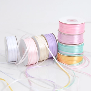 Close-up of 3mm double-sided polyester satin ribbons in assorted macaron pastel colors