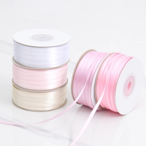 Detail of 3mm double-sided polyester satin ribbons in pastel colors for DIY gift wrapping