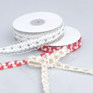Detail of embroidered plum blossom ribbons with pearls for DIY hair bows and gift wraps