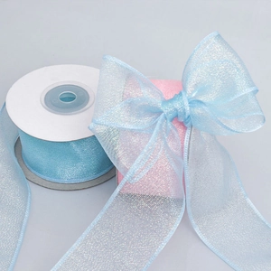 Iridescent glitter organza ribbon rolls in light blue and pink for DIY hair bows and decor