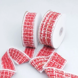 Detail of red and white tweed ribbon with gold glitter thread and white fuzzy edges