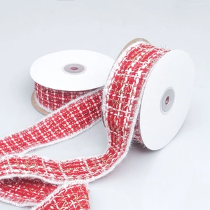 Red and white tweed ribbon with gold silk threads and fringe edges on rolls
