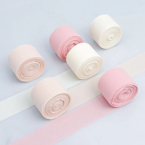 Detail of sheer chiffon ribbons in pastel shades for DIY bow making and floral crafts