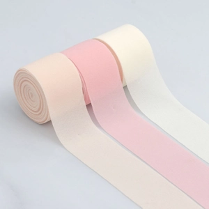Three rolls of elastic chiffon ribbons in soft pink, beige, and light rose for DIY crafts