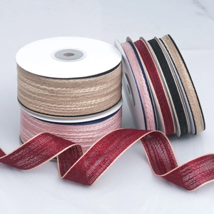 Macro detail of multi-color cotton ribbons with contrast stitching for DIY crafts