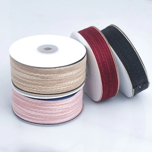 DIY cotton ribbon rolls in beige, pink, burgundy and black with textured edge detail