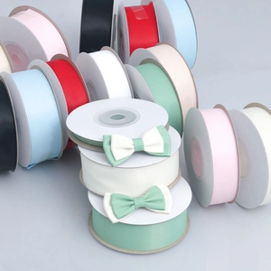 Close-up of colorful polyester satin ribbons with DIY bows for floral and gift wrapping