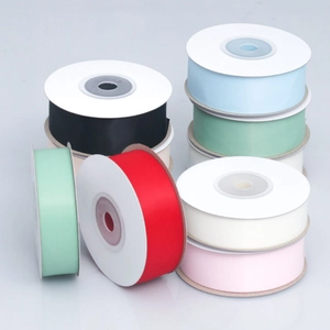 Close-up of matte polyester ribbons in various colors for DIY crafts and gift wrapping