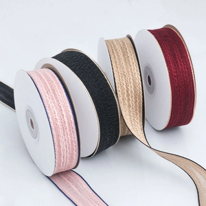 Double-sided cotton woven ribbons in four colors for DIY hair bows and craft projects