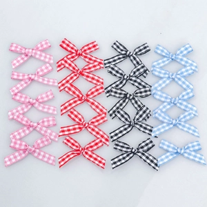 Collection of small gingham checkered bows in pink, red, black, and blue colors