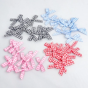 Plaid ribbon bows in black, blue, red, and pink colors for DIY sewing crafts