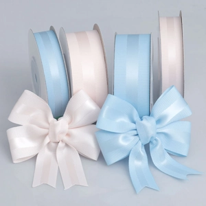 Light blue and beige grosgrain ribbons with satin stripes for gift wrapping and DIY crafts