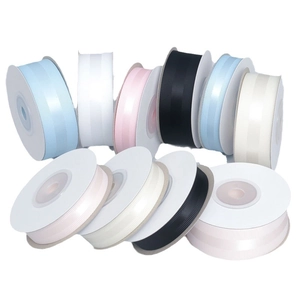 Multiple colors of solid ribbed grosgrain ribbon rolls for gift wrapping and DIY crafts