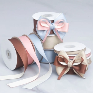 Detailed view of matte cotton-polyester ribbons in multiple colors with DIY decorative bows