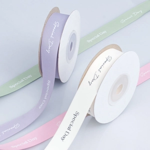 Pastel gift ribbons with Special Day text in lavender, beige, green and pink rolls