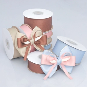 Detail of high-density matte satin ribbons in pastel colors with elegant ribbon bows