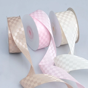 Checkered satin ribbon rolls in pink, beige, and light brown for DIY crafts and decor
