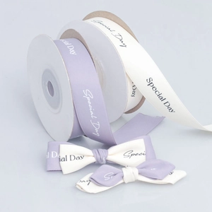 Polyester satin ribbon rolls and handmade bows with Special Day print for gift wrapping