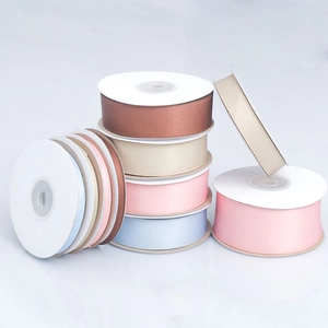 Matte polyester cotton ribbon rolls in various pastel colors for gift wrapping