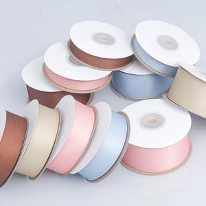 Assorted matte polyester-cotton ribbon rolls for gift wrapping and floral bouquets