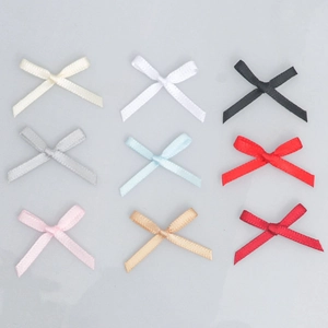 Detailed grid of 9 colors of mini satin ribbon bows for DIY garment accessories