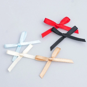 Detailed view of small satin ribbon bows for underwear and DIY craft decoration