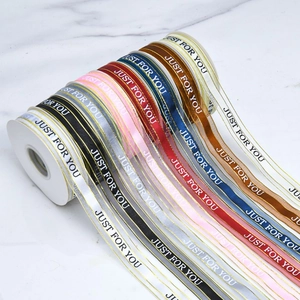 Detail of assorted Just For You ribbons with gold edges for luxury gift packaging