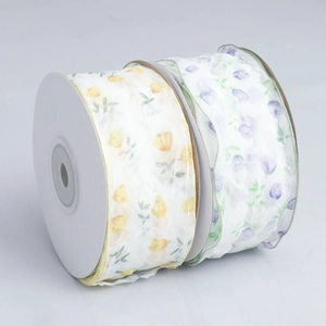 Detail of floral printed organza ribbons in yellow tulip and purple flower patterns