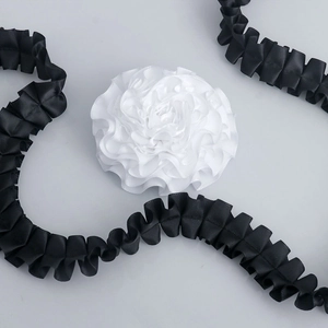 Detailed macro view of 2.5cm pleated polyester lace ribbon for DIY apparel and floral wrapping