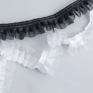 Detail of 4cm pleated double-layer polyester ruffle lace trim in black and white colors