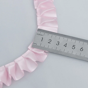 Pink pleated satin ribbon with 25mm width measurement for clothing and gift wrap