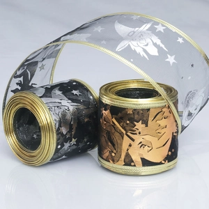 Detail of Halloween ribbons with silver and bronze witch prints on transparent mesh