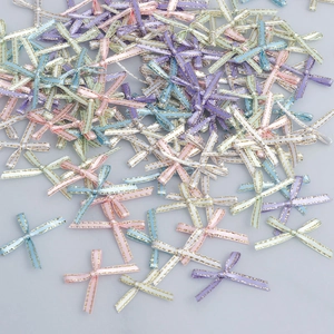 Macro view of colorful 0.3cm mini bows with gold edges for DIY garment accessories