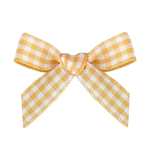 Handmade yellow gingham plaid ribbon bow for gift box decoration and DIY crafts