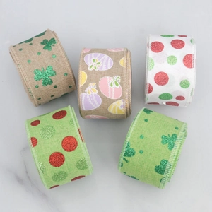Detail of five assorted wired edge ribbons featuring glitter clover and Easter egg patterns