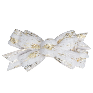 Macro shot of elegant white velvet Christmas bow with gold glitter and metallic texture