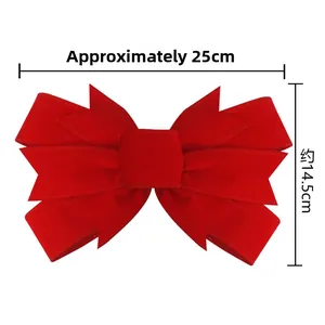 Detailed view of a red velvet Christmas bow showing dimensions 25cm width and 14.5cm height