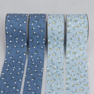 Floral print fabric ribbon rolls in light and dark blue for DIY hair accessories and gifts