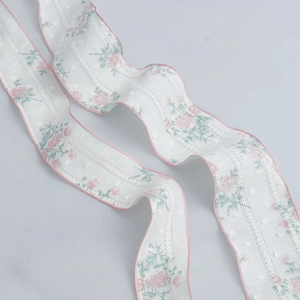 Floral lace ribbon with pink scalloped edges for DIY crafts and hair accessories