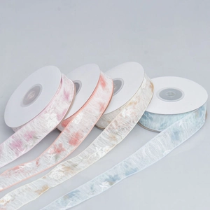 Detail of floral chiffon ribbons in pink, orange, beige and blue for DIY hair accessories