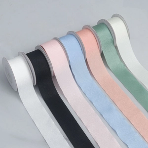 Macro detail of high-elasticity matte polyester ribbon rolls in seven pastel color variants