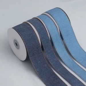 Close-up of four-color denim ribbons with orange stitching for DIY hair bow accessories