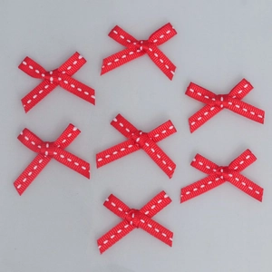 Set of seven handmade red 6mm grosgrain ribbon bows with white dashed lines for DIY