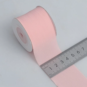 Pink matte semi-transparent snow yarn ribbon roll for DIY crafts and gift wrapping