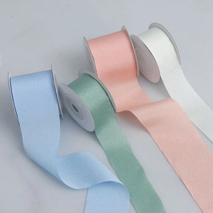 Close-up of matte high-elastic polyester ribbons in pastel colors for gift wrapping