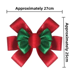 Detail view of large red and green burlap Christmas bow with dimensions 27cm by 25cm