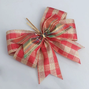 Close-up of red and gold checkered burlap bow for Christmas tree and gift wrapping