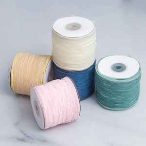 Detail of five multi-color pleated chiffon ribbons for floral bouquets and DIY crafts