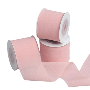 Three rolls of pink semi-transparent chiffon ribbons for DIY gift wrapping and hair decor