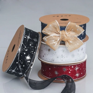 Detail of starry silver stamping on colorful sheer ribbons for floral gift wrapping
